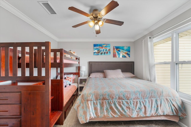 bedroom with carpet floors, ceiling fan, and ornamental molding