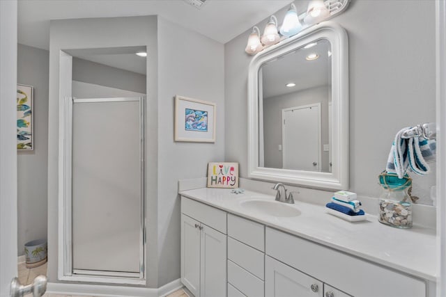 bathroom with vanity and an enclosed shower