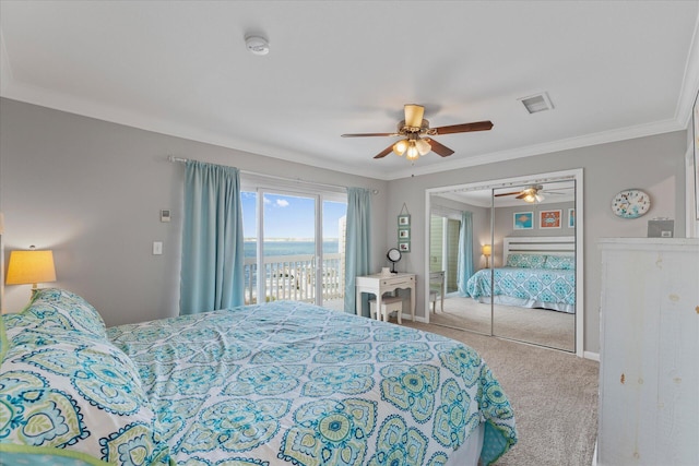 carpeted bedroom with a closet, access to outside, ceiling fan, and ornamental molding