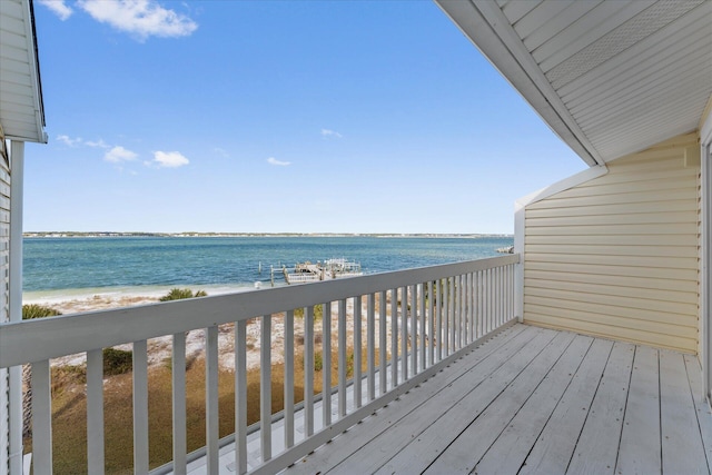 deck with a water view and a beach view