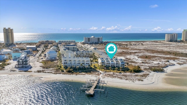 bird's eye view with a water view and a view of the beach