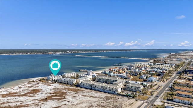 bird's eye view with a water view and a beach view