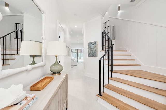 stairway featuring baseboards, tile patterned floors, recessed lighting, and visible vents