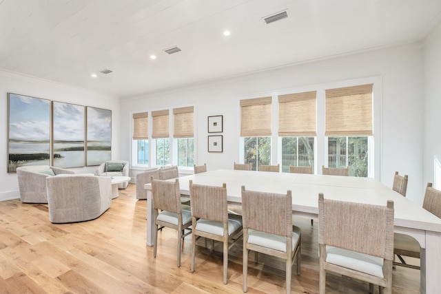 dining space with ornamental molding, recessed lighting, visible vents, and light wood-style floors