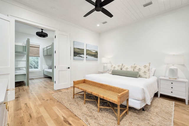 bedroom featuring visible vents, ceiling fan, light wood-style flooring, wood ceiling, and baseboards