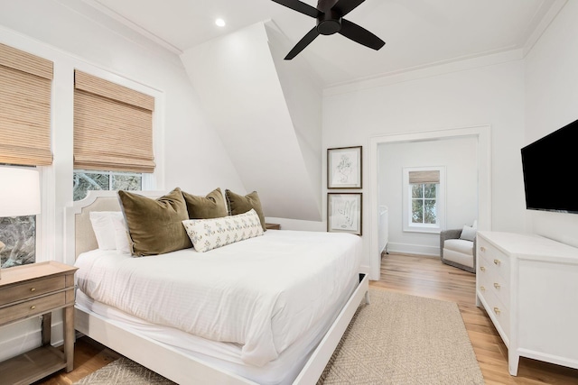 bedroom with crown molding, light wood-type flooring, ceiling fan, and recessed lighting