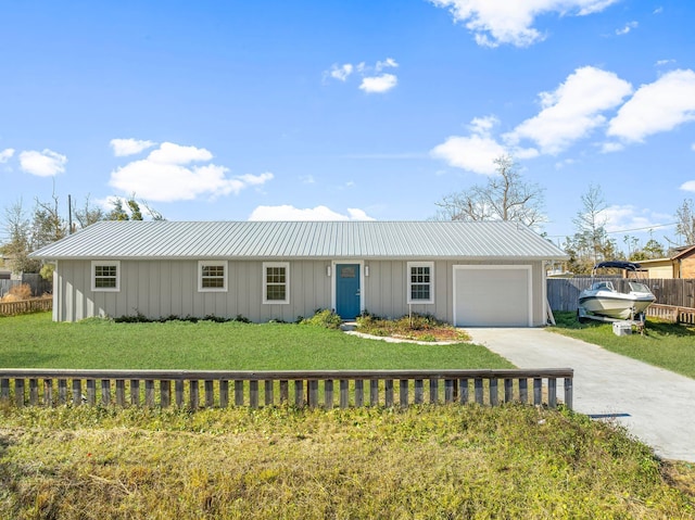 view of front facade with a front yard and a garage