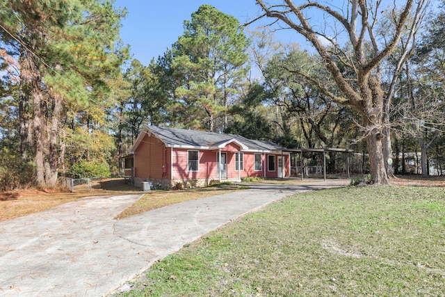 single story home with a front yard and a carport