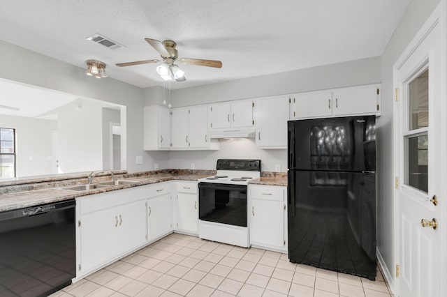 kitchen featuring black appliances, white cabinets, sink, light tile patterned floors, and a textured ceiling