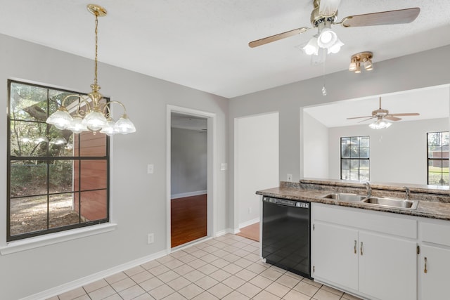 kitchen featuring pendant lighting, sink, light tile patterned floors, black dishwasher, and white cabinetry