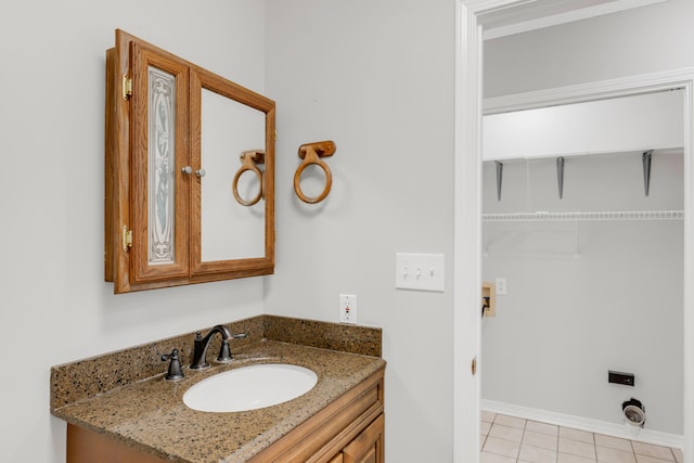 bathroom with vanity and tile patterned floors