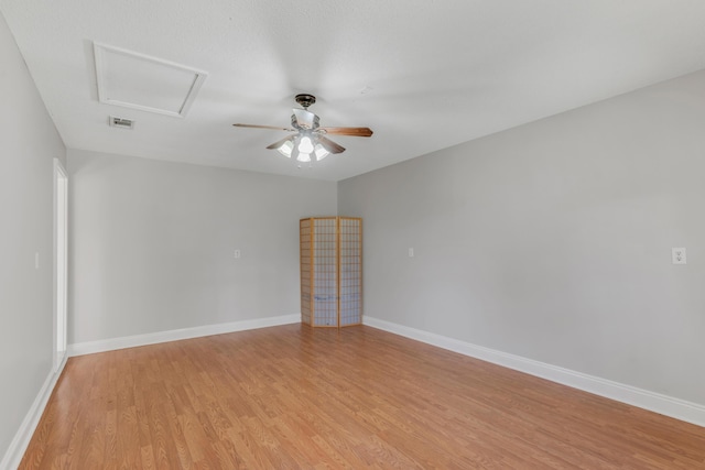 spare room with ceiling fan and light hardwood / wood-style flooring