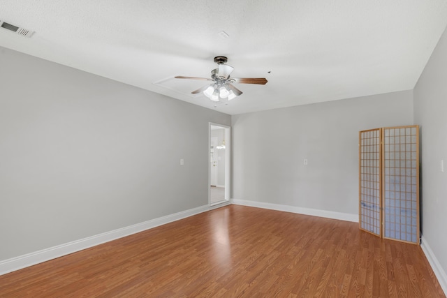 spare room with light hardwood / wood-style floors and ceiling fan