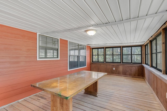 unfurnished sunroom featuring wood ceiling