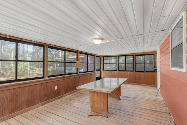 unfurnished sunroom featuring wood ceiling