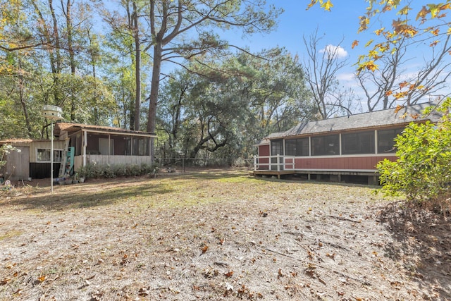 view of yard featuring a sunroom