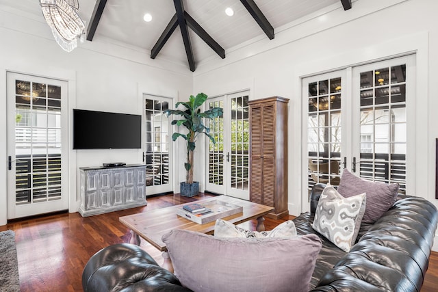 living room with french doors, an inviting chandelier, lofted ceiling with beams, dark hardwood / wood-style floors, and wood ceiling