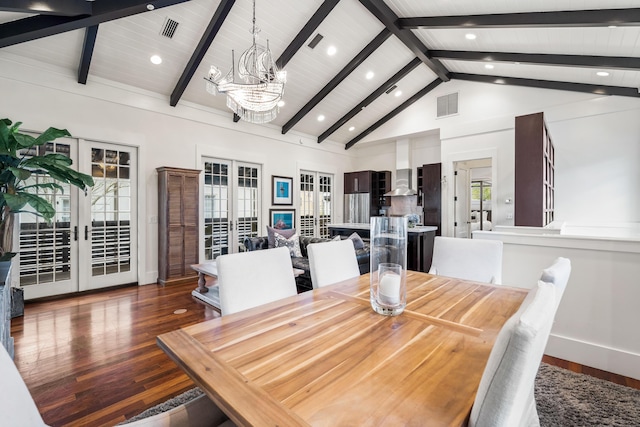 dining room with a healthy amount of sunlight, dark hardwood / wood-style flooring, high vaulted ceiling, and french doors