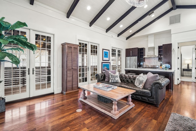 living room featuring french doors, high vaulted ceiling, and beam ceiling