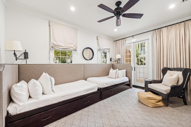 sitting room with ceiling fan, a healthy amount of sunlight, and ornamental molding