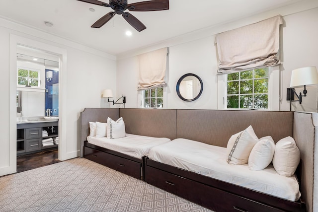 interior space with ceiling fan and crown molding