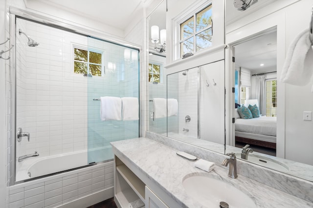 bathroom with vanity and enclosed tub / shower combo