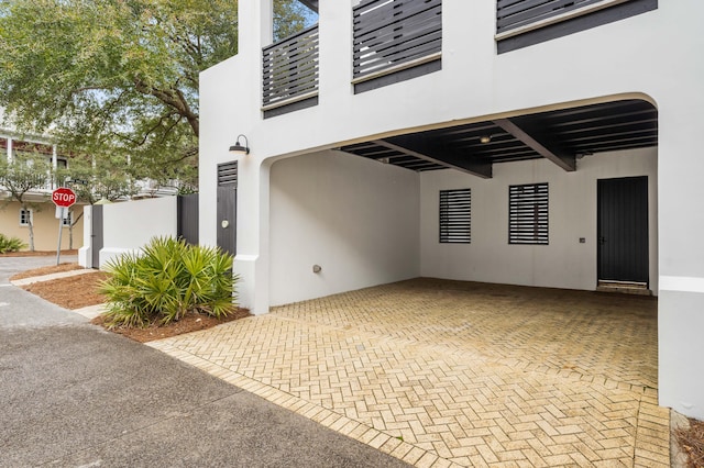 exterior space featuring a carport