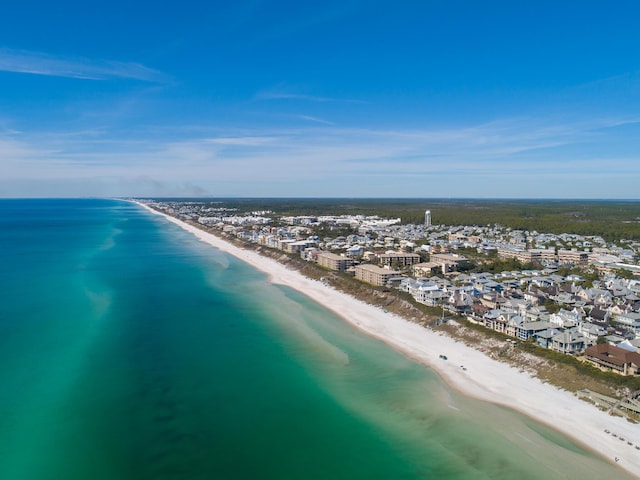 drone / aerial view featuring a view of the beach and a water view