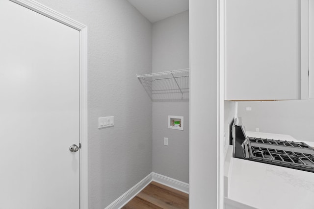 laundry area featuring hookup for a washing machine and hardwood / wood-style floors