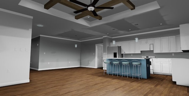 kitchen with a breakfast bar, stainless steel fridge, white cabinetry, and range with electric stovetop