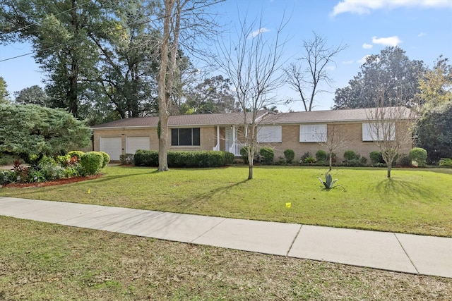 single story home with a front lawn and a garage