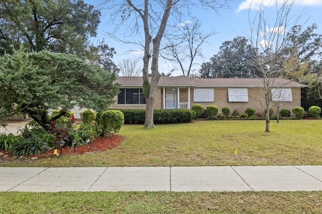 ranch-style house with a front lawn