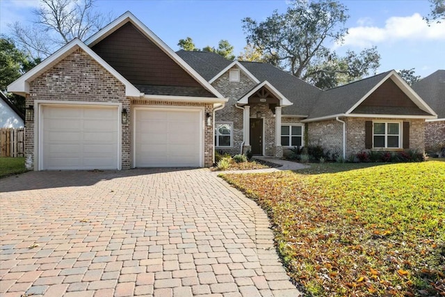 view of front of home with a garage and a front lawn