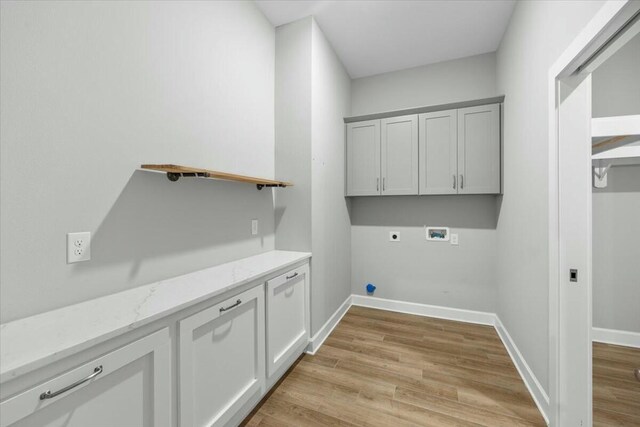 clothes washing area with washer hookup, light hardwood / wood-style flooring, and hookup for an electric dryer