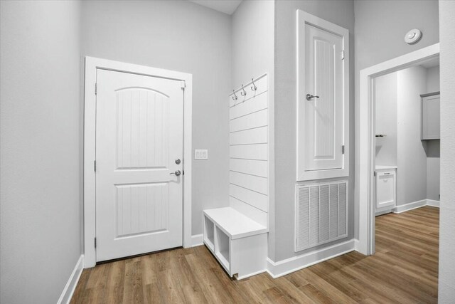 mudroom with hardwood / wood-style floors