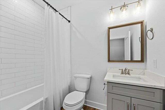 full bathroom with vanity, toilet, and shower / bath combo