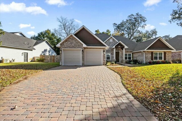 view of front facade featuring a garage and a front lawn