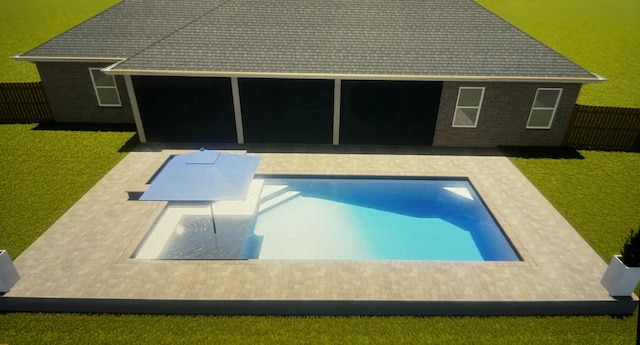 view of swimming pool with a yard and a patio area