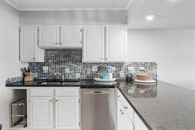 kitchen featuring backsplash, white cabinets, sink, stainless steel dishwasher, and dark stone countertops