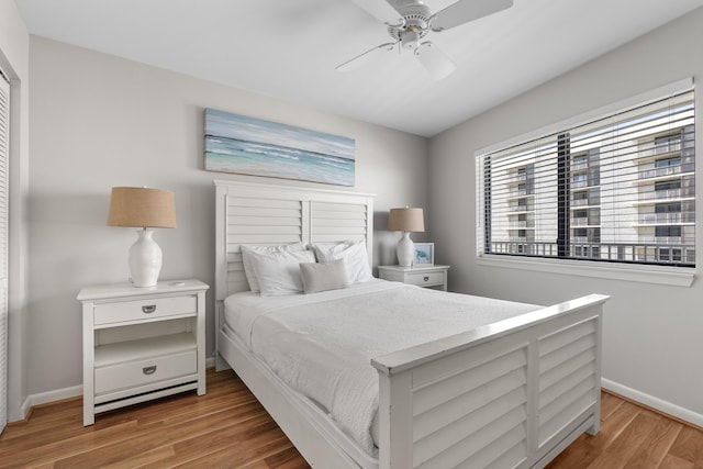 bedroom featuring ceiling fan and light hardwood / wood-style floors