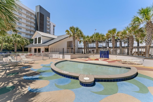 view of swimming pool with a patio area