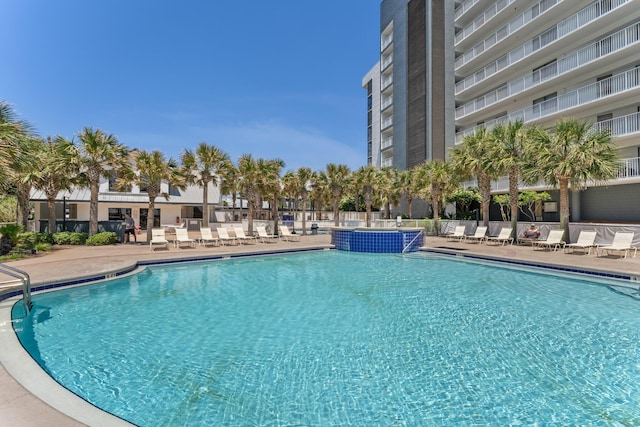 view of pool featuring a patio