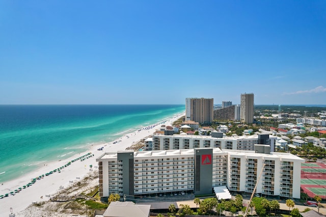 drone / aerial view featuring a water view and a beach view