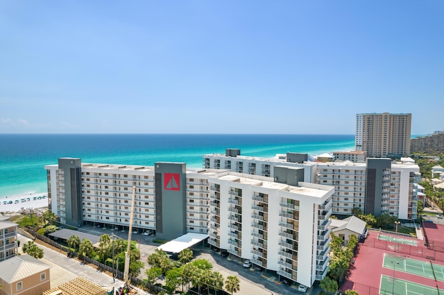 drone / aerial view with a water view and a beach view