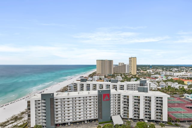 bird's eye view with a water view and a beach view