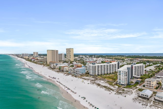 drone / aerial view with a beach view and a water view