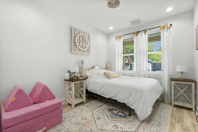 bedroom featuring light hardwood / wood-style floors