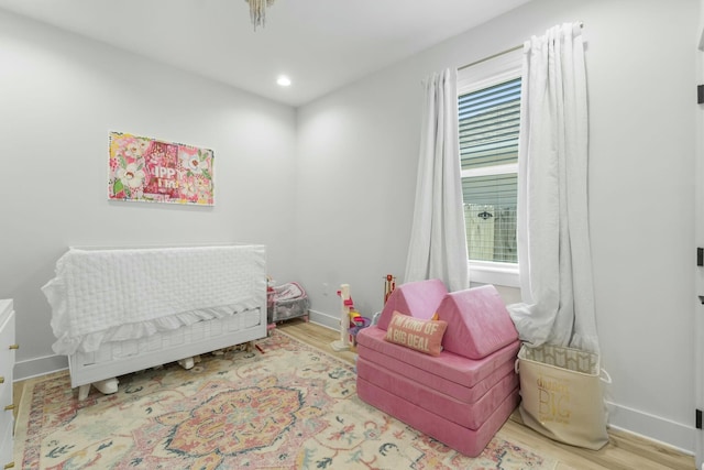 bedroom with light hardwood / wood-style floors