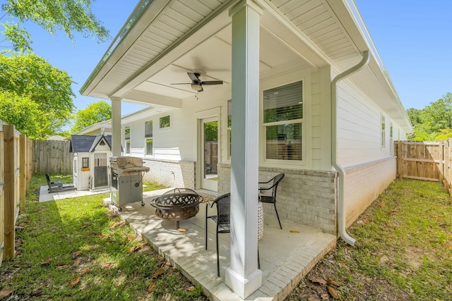 view of patio / terrace featuring area for grilling and a fire pit