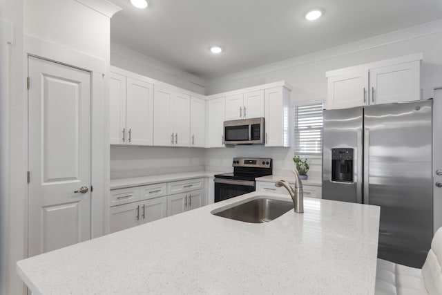 kitchen featuring light stone counters, white cabinets, and appliances with stainless steel finishes